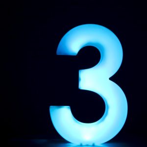 the number 3 in blue with black background